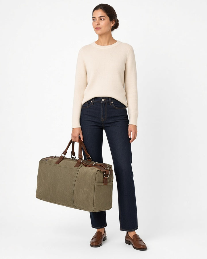 Hayes Waxed Canvas Weekender - worn by model, full-length, white studio