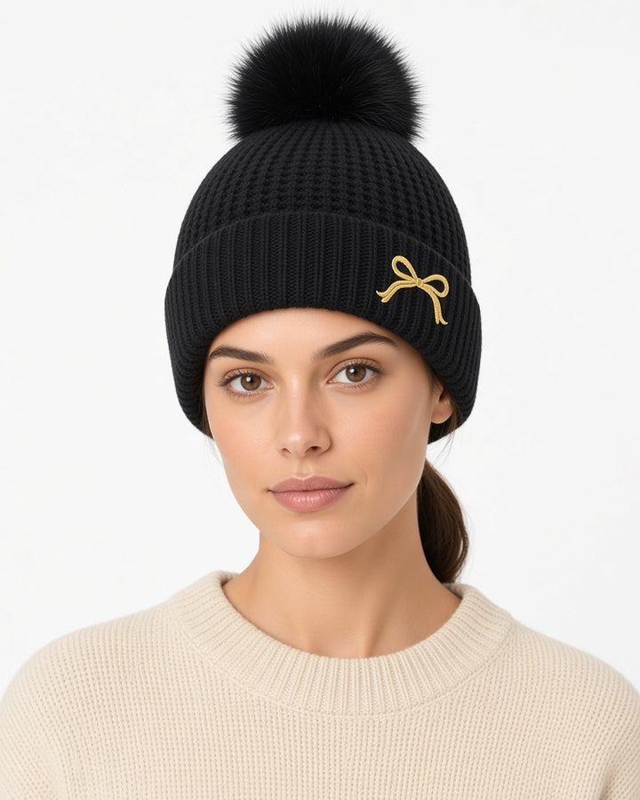 Posy Faux Fur Pom Bow Beanie - worn by model, front (white studio)