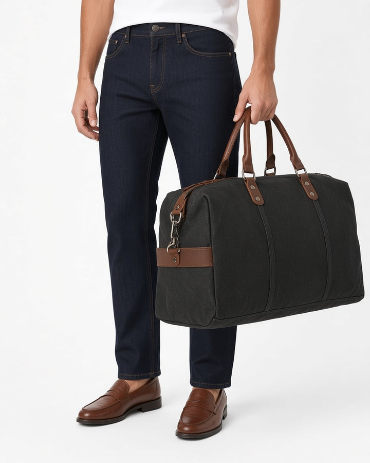 Hayes Waxed Canvas Weekender - worn by model, waist-up, white studio