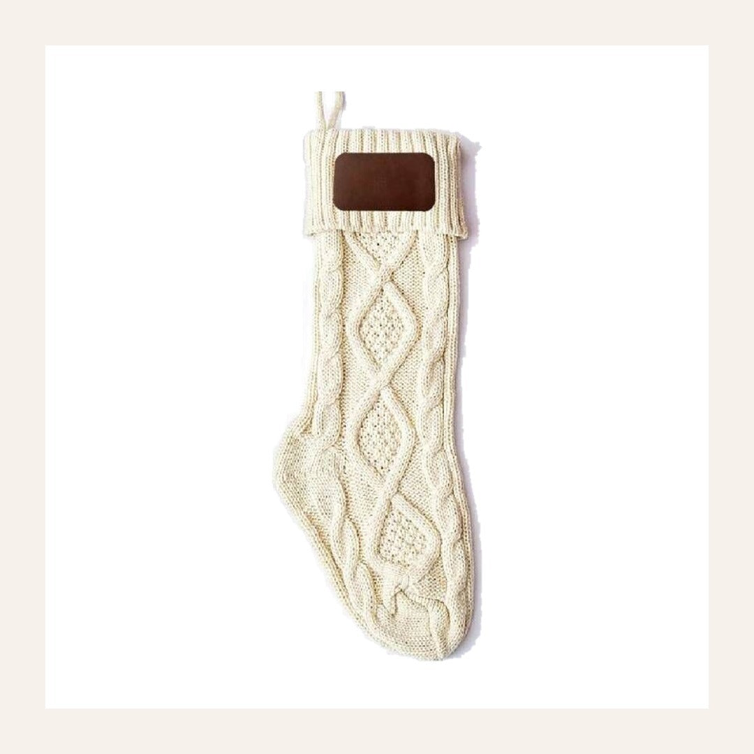 Noelle cable-knit stocking in cream