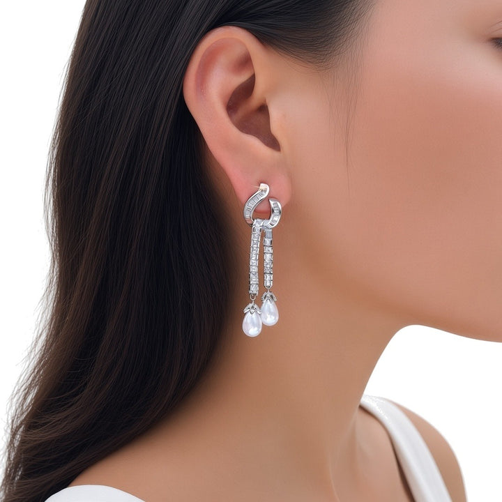 Seraphina pearl drop earring worn, side profile view (illustration)