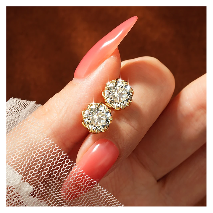 Stella studs in yellow gold tone, held